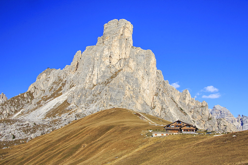 Autumnal view of the high rocky peak of Ra Gusela from Falzarego Pass, Dolomites of Belluno, Trentino-Alto Adige, Italy, Europe