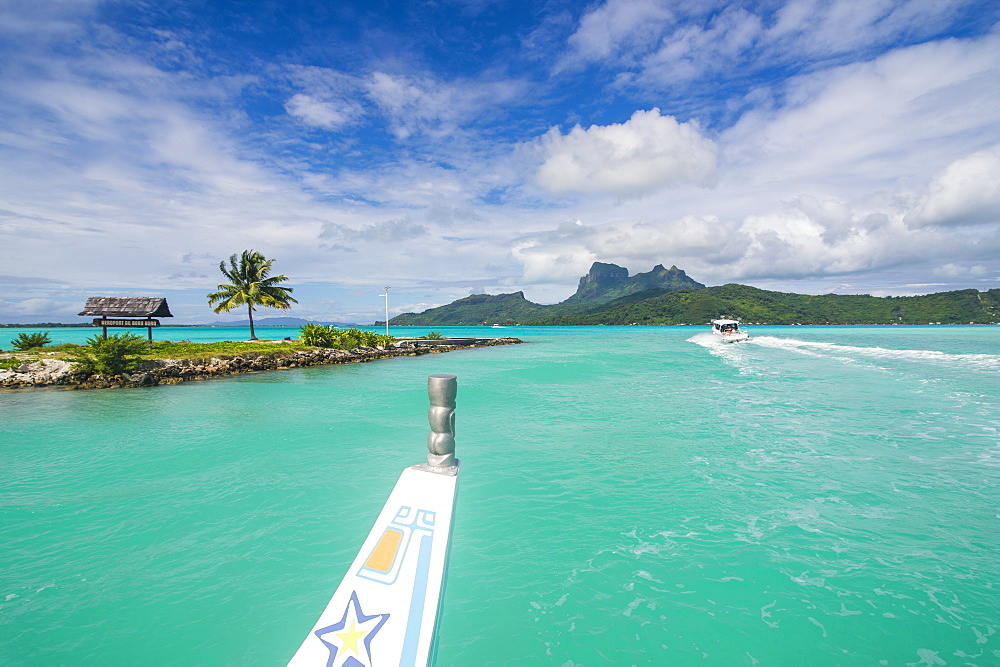 Little boat in the turquoise lagoon of Bora Bora, Society Islands, French Polynesia, Pacific