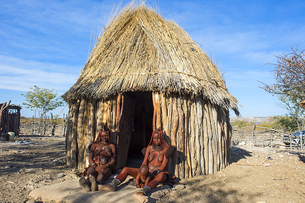 Himba women in front of their hut, Kaokoland, Namibia, Africa