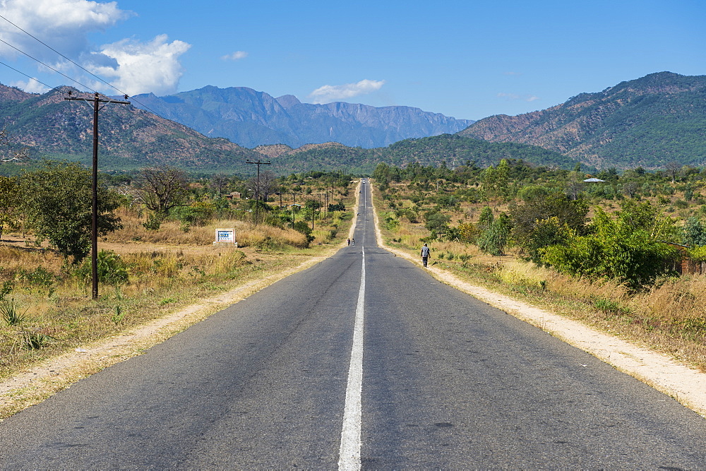 Long straight road in central Malawi, Africa