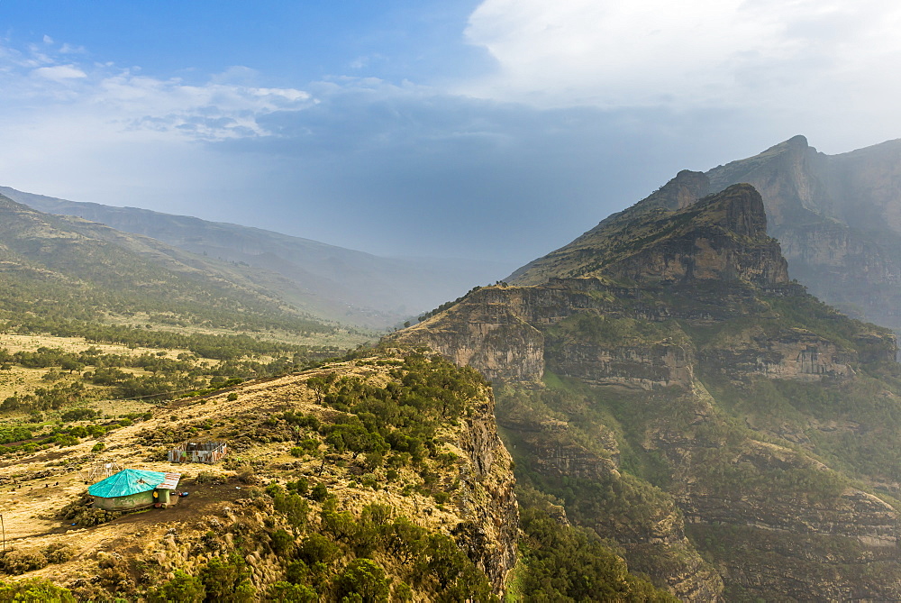 Community house on the edge of a cliff, Simien Mountains National Park, UNESCO World Heritage Site, Debarq, Ethiopia, Africa