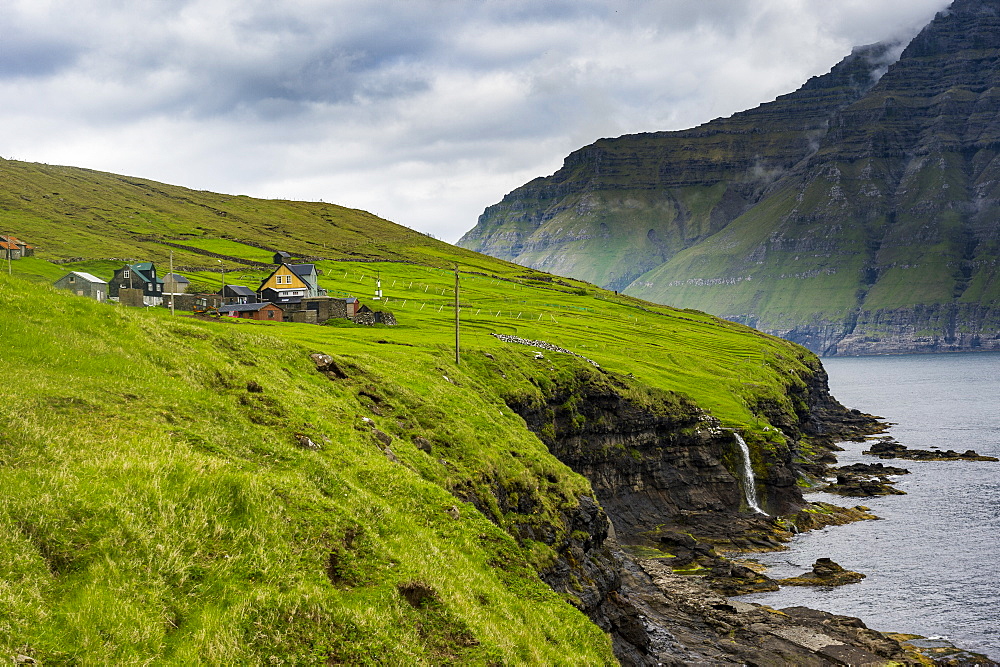 Waterfall into the ocean, Bordoy, Faroe Islands, Denmark, Europe