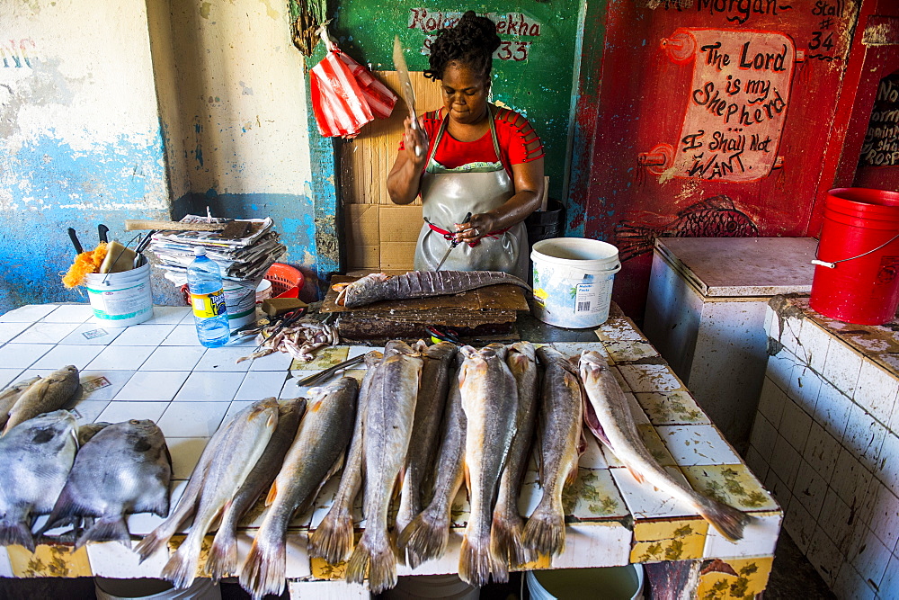 Woman preparing fresh fish in the Stabroek market, Georgetown, Guyana, South America