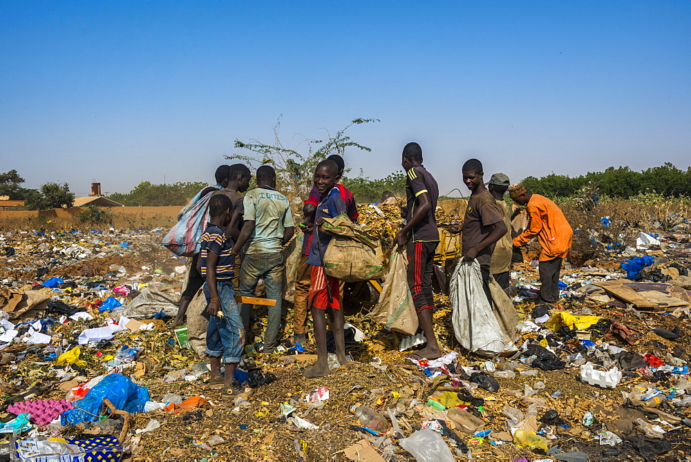 Local boys looking for valuables in the public rubbish dump, Niamey, Niger, Africa