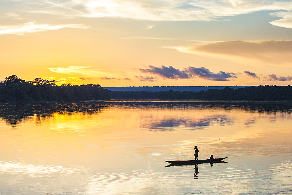 Boys washing themselves at sunset over the Sangha River flowing through the Dzanga-Sangha Special Reserve, UNESCO World Heritage Site, Central African Republic, Africa