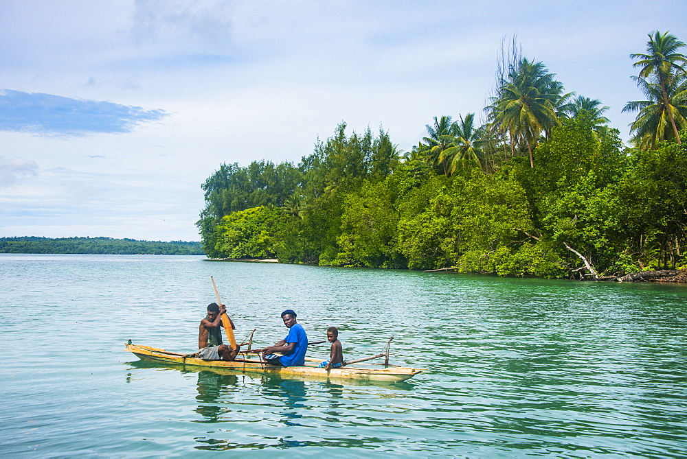 Locals in a dugout canoe, Kavieng, New Ireland, Papua New Guinea, Pacific