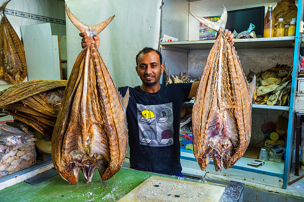 Man selling a huge dried fish, Jemenite market, Jeddah, Saudi Arabia, Middle East