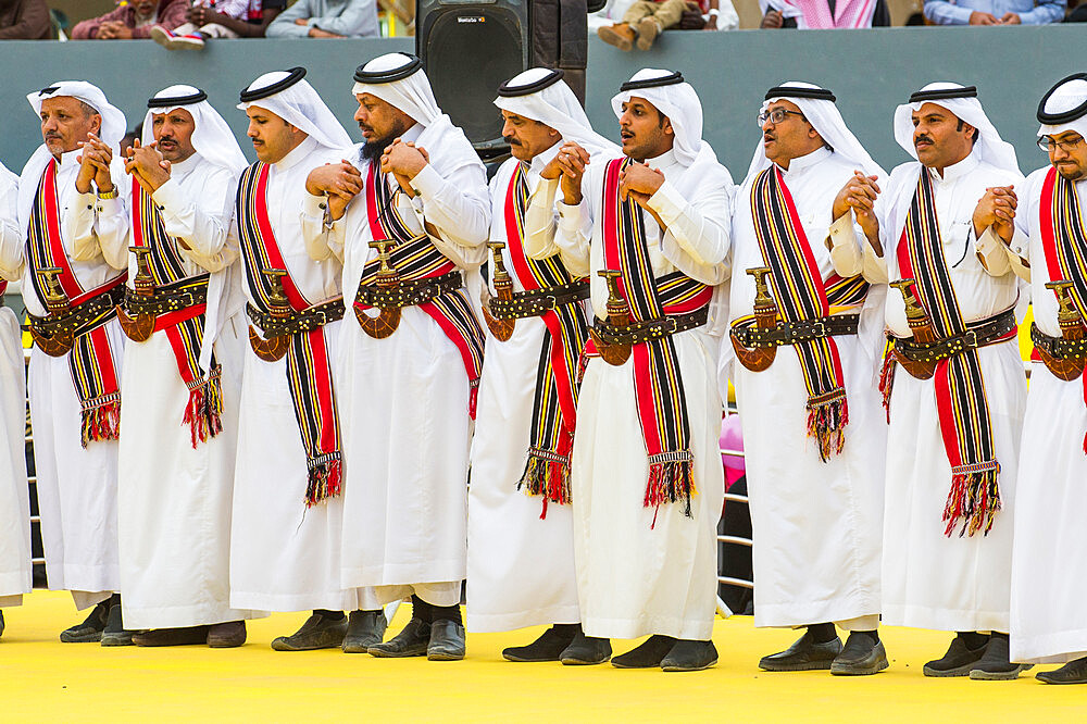 Traditional dressed local tribesmen dancing at the Al Janadriyah Festival, Riyadh, Saudi Arabia, Middle East