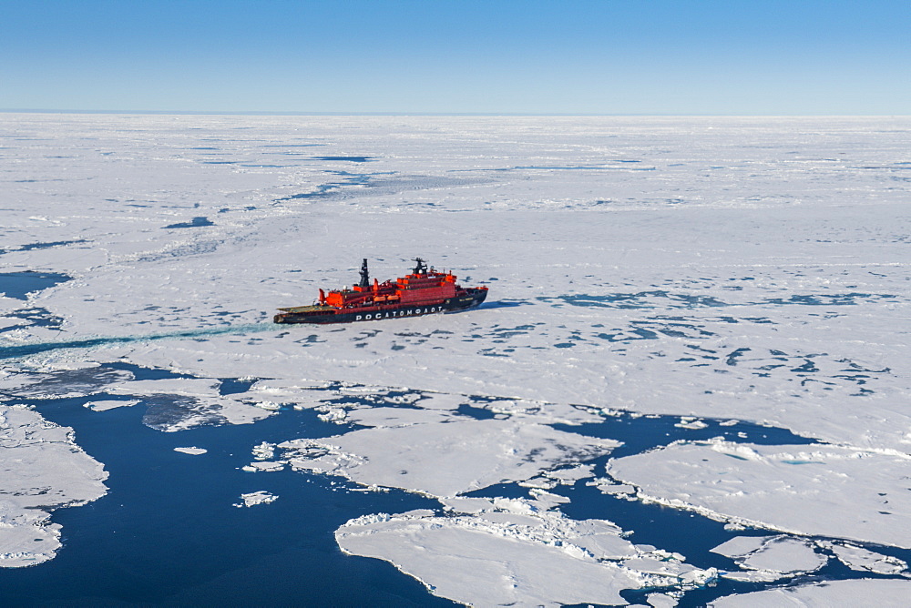 Aerial of the Icebreaker '50 years of victory' on its way to the North Pole breaking through the ice, Arctic