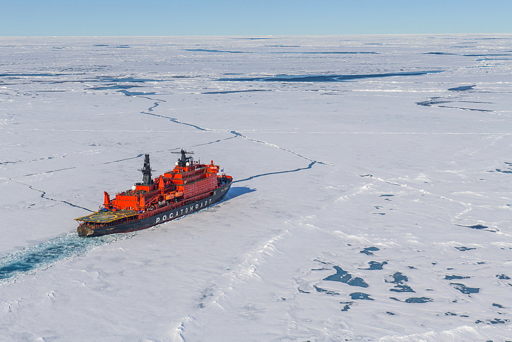 Aerial of the Icebreaker '50 years of victory' on its way to the North Pole breaking through the ice, Arctic