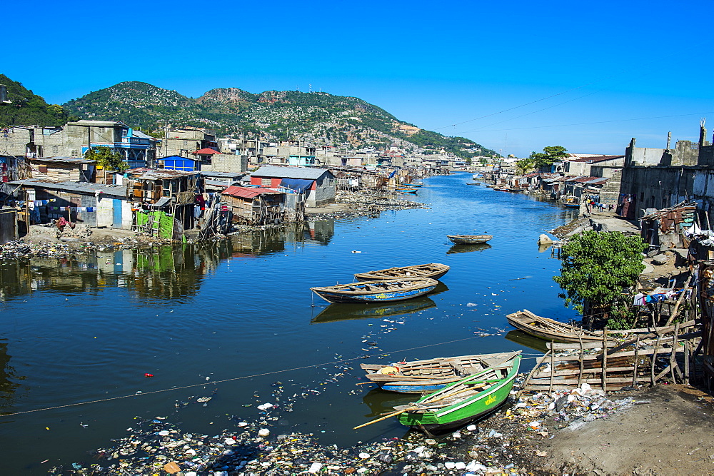 Totally polluted River Mapou flowing through Cap Haitien, Haiti, Caribbean, Central America