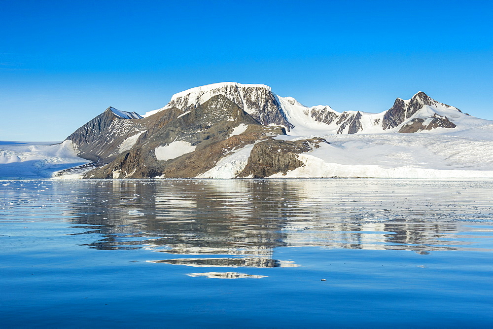 Mountains reflecting in glassy water of Hope Bay, Antarctica, Polar Regions