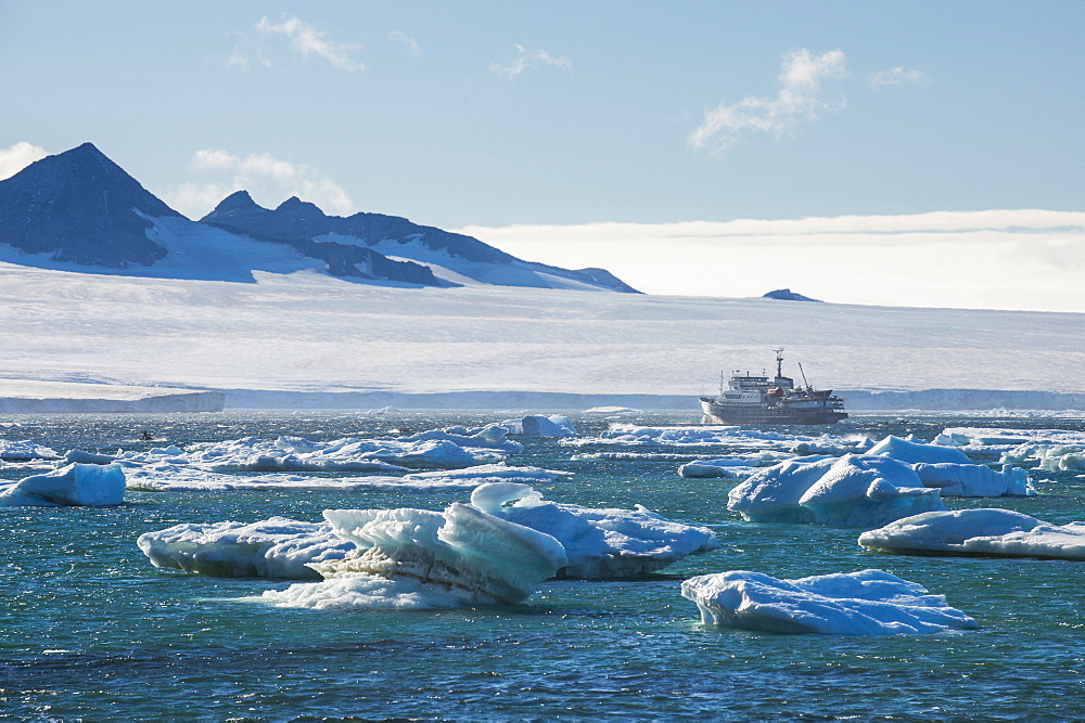 Cruise ship behind icebergs, Brown Bluff, Tabarin Peninsula, Antarctica, Polar Regions