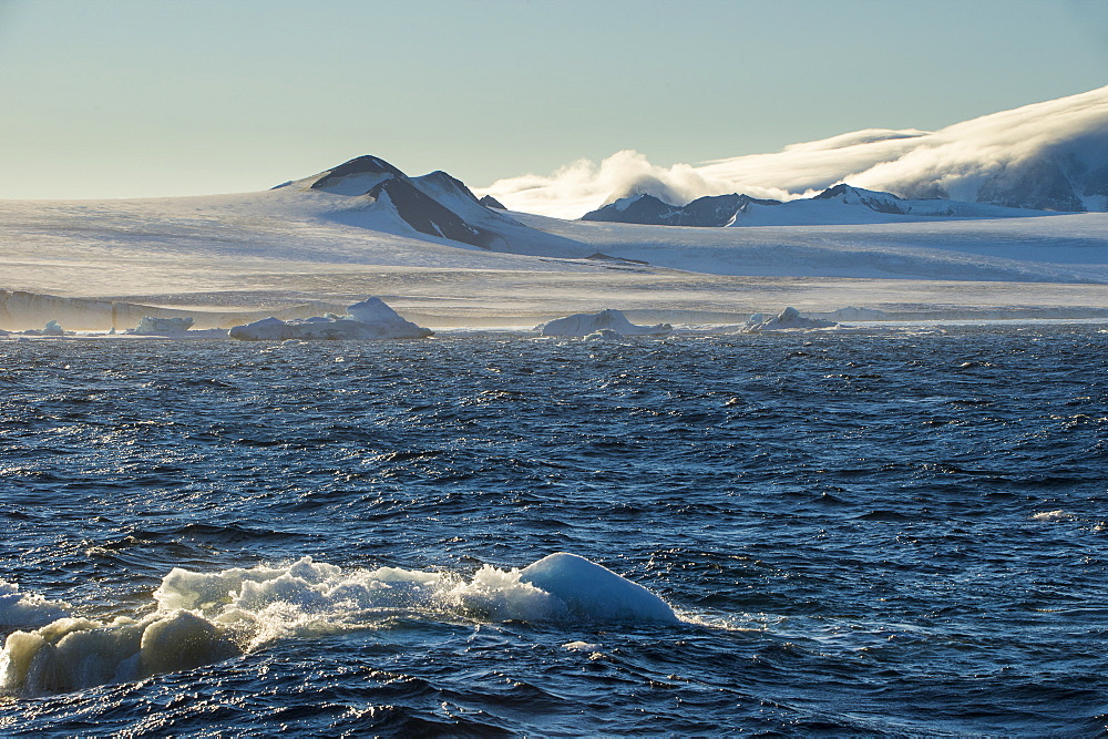 Little icebergs floating in front of the huge glaciers on Tabarin Peninsula, Antarctica, Polar Regions