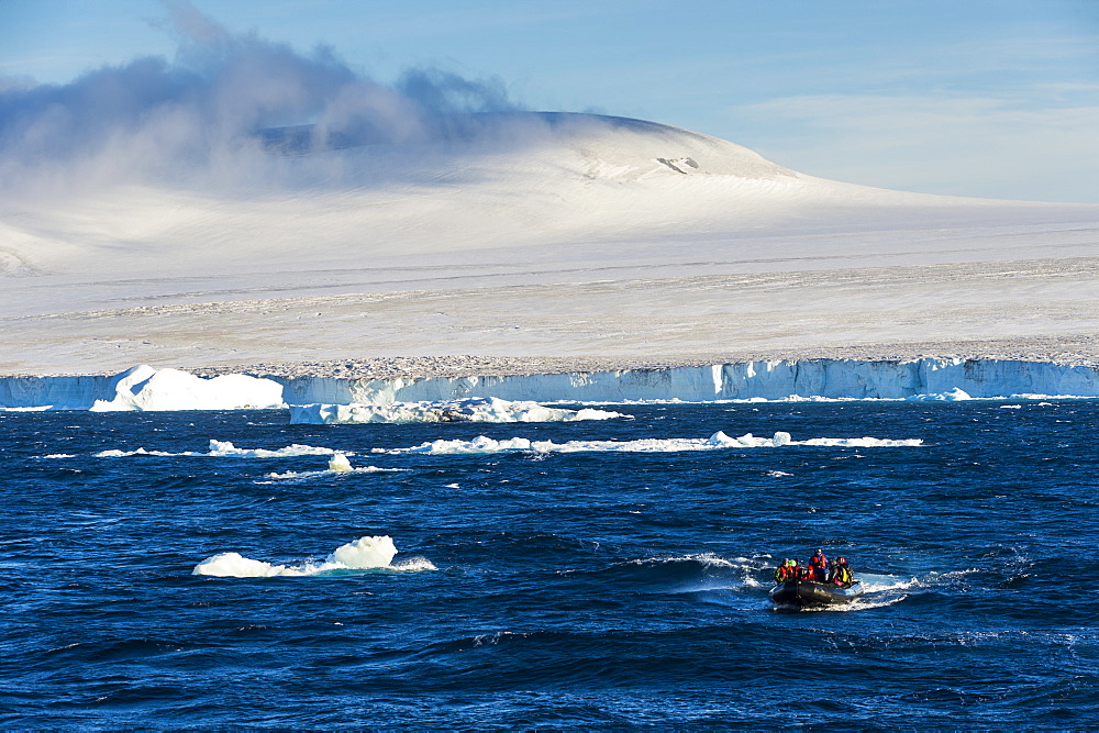 Zodiac with tourists cruising through the icebergs, Brown Bluff, Tabarin Peninsula, Antarctica, Polar Regions