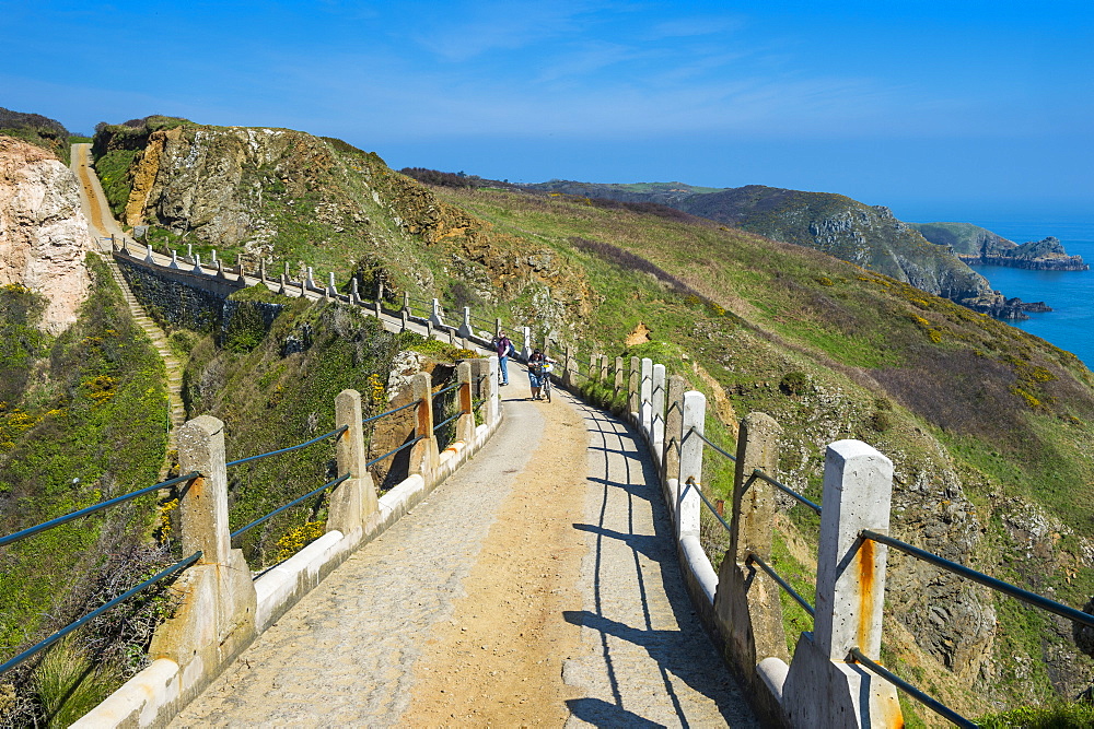 Road connecting the narrow isthmus of Greater and Little Sark, Channel Islands, United Kingdom, Europe