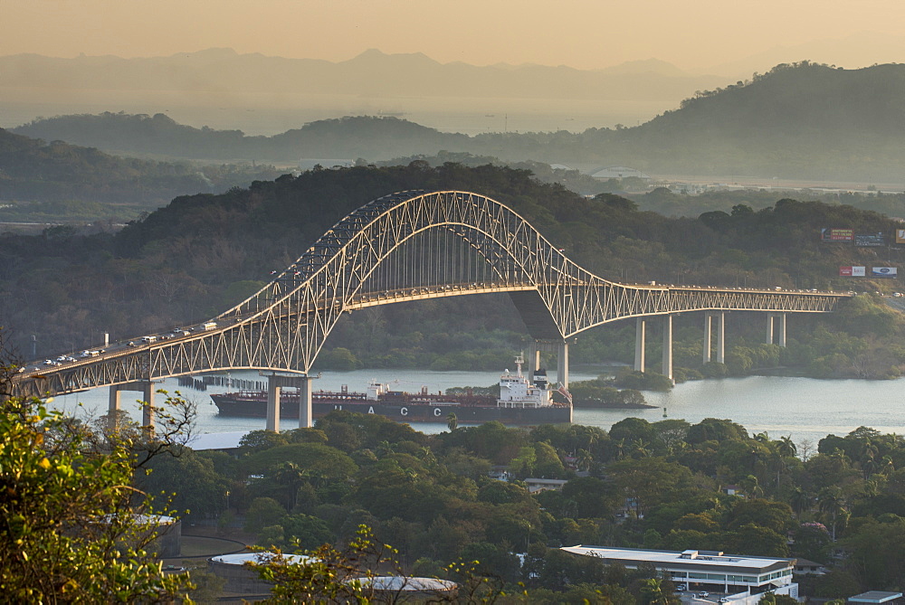 Cargo boat passes the Bridge of the Americas on the Panama Canal, Panama City, Panama, Central America