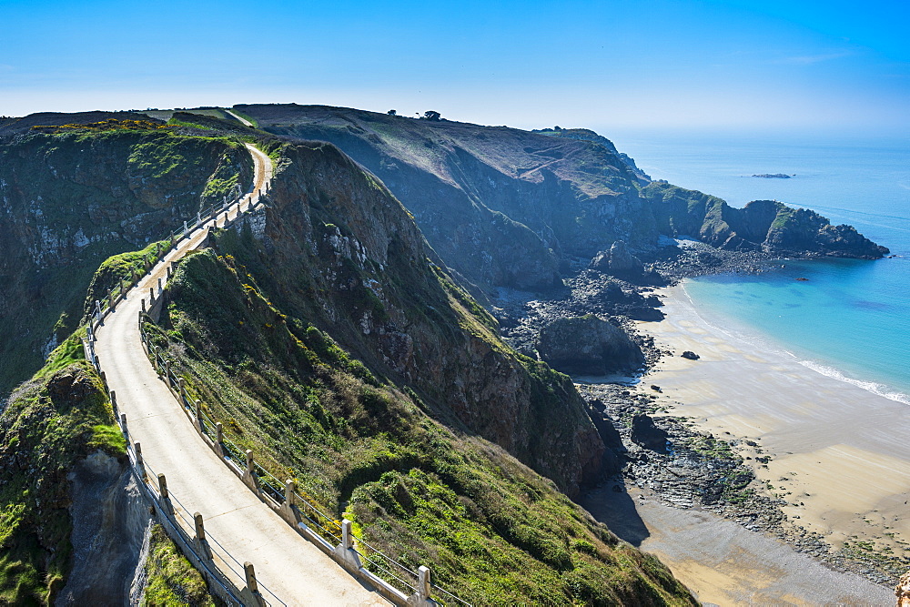 Road connecting the narrow isthmus of Greater and Little Sark, Channel Islands, United Kingdom, Europe