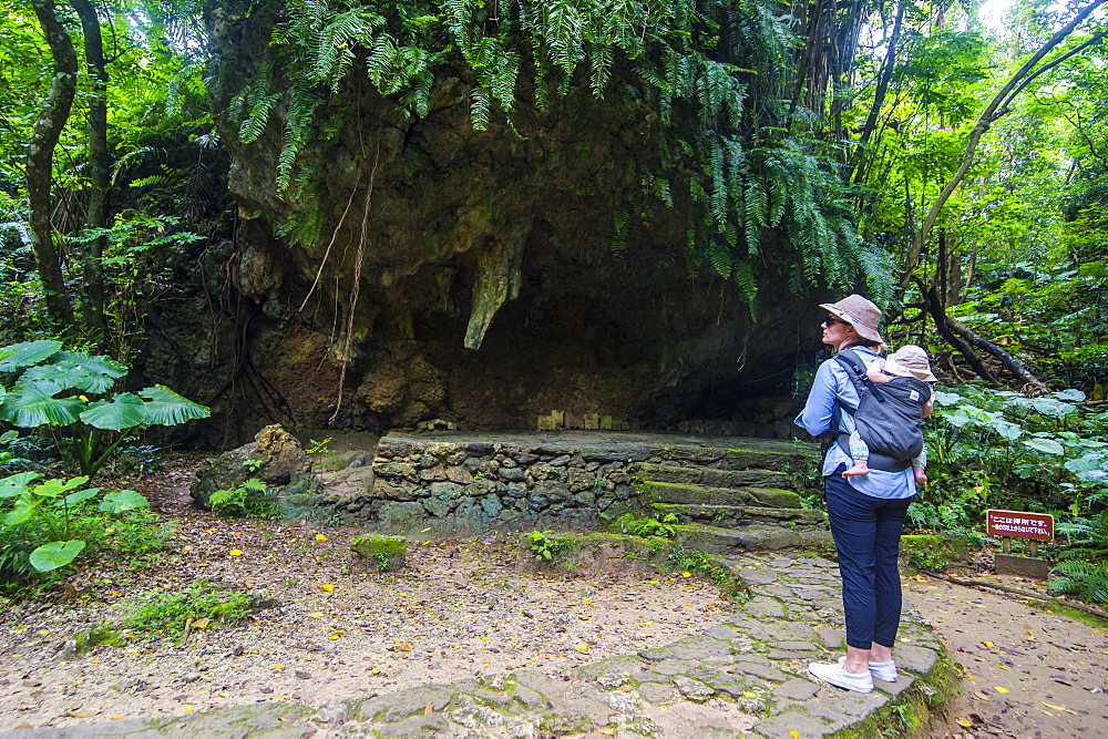 Woman with a baby hiking in the Sacred site of Sefa Utaki, UNESCO World Heritage Site, Okinawa, Japan, Asia