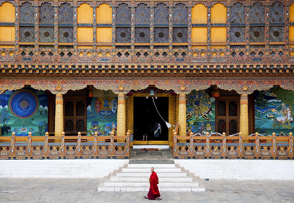 Monk walking through Punakha Dzong, Punakha District, Bhutan, Asia