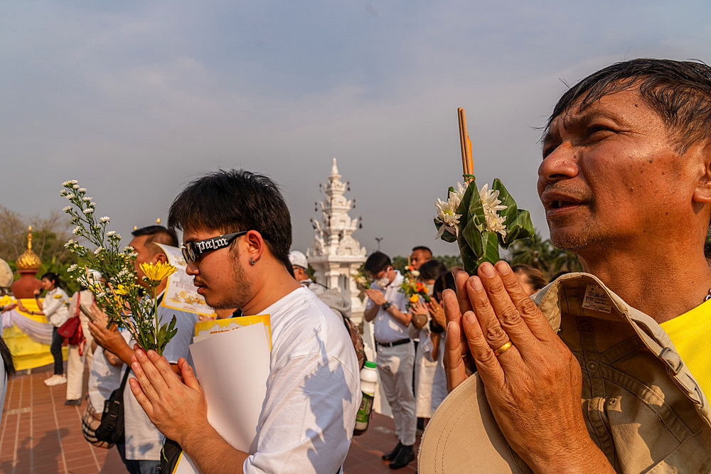 Devotees attending the Makha Bucha Buddhist celebrations where relics of Buddha are enshrined at the Royal Park Rajapruek, Chiang Mai, Thailand, Southeast Asia, Asia