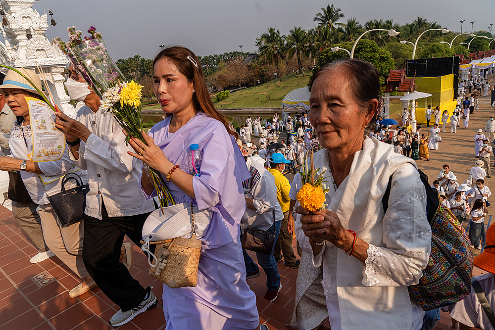 Devotees attending the Makha Bucha Buddhist celebrations where relics of Buddha are enshrined at the Royal Park Rajapruek, Chiang Mai, Thailand, Southeast Asia, Asia