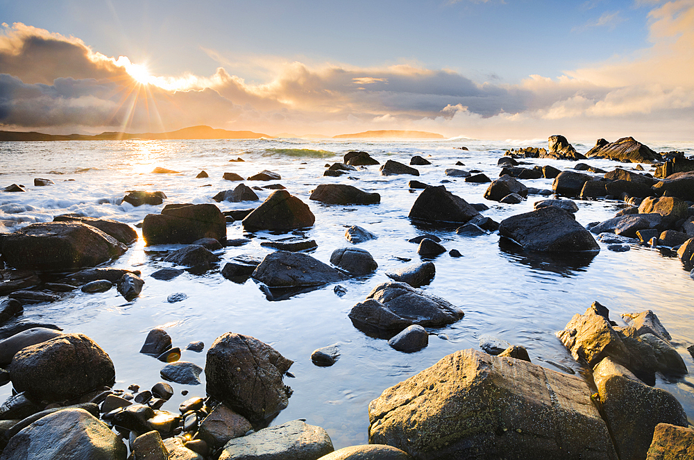 Overlooking rocky Reiff Bay at sunrise with the Summer Isles in the background off the shores of northwest Scotland, Highland, Scotland, United Kingdom, Europe