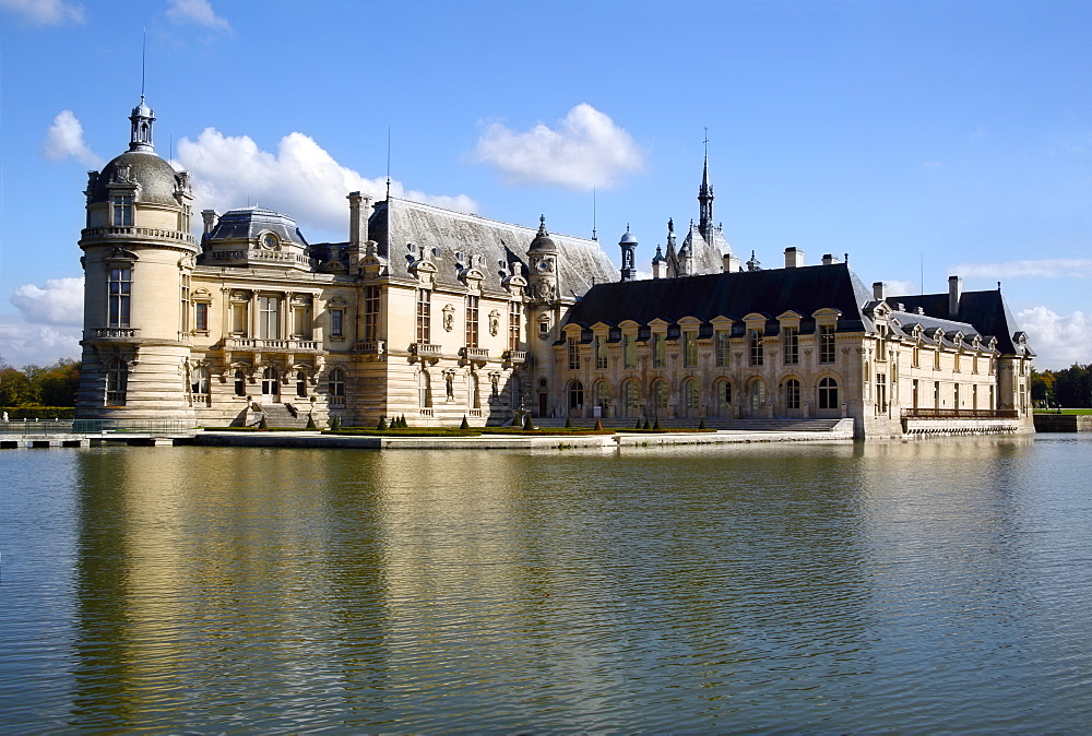 Chateau Chantilly across the moat, Chantilly, Oise, France, Europe