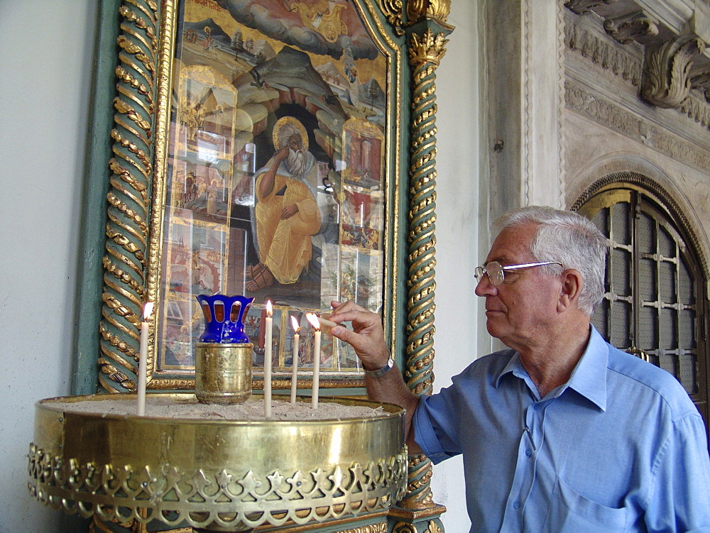 Turkey lighting a candle at saint georges church at the greek patriarchate, istanbul