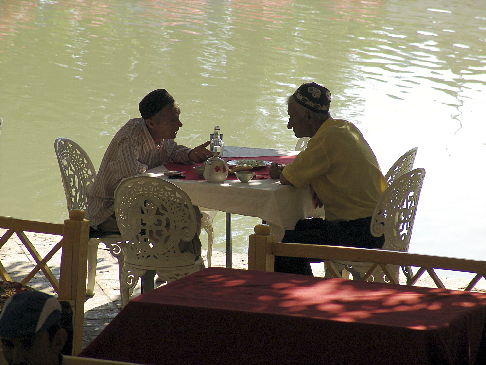 Uzbekistan men drinking tea at the lyab-i-hauz, bukhara