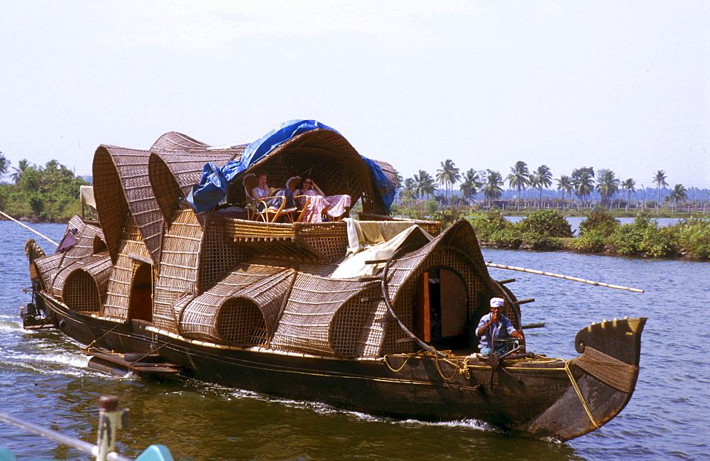 India - tourism: tourist house boat on the inland waterways of kerala