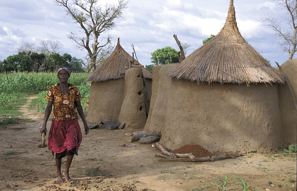 Ghana woman walking beside her house bongo village bolgatanga