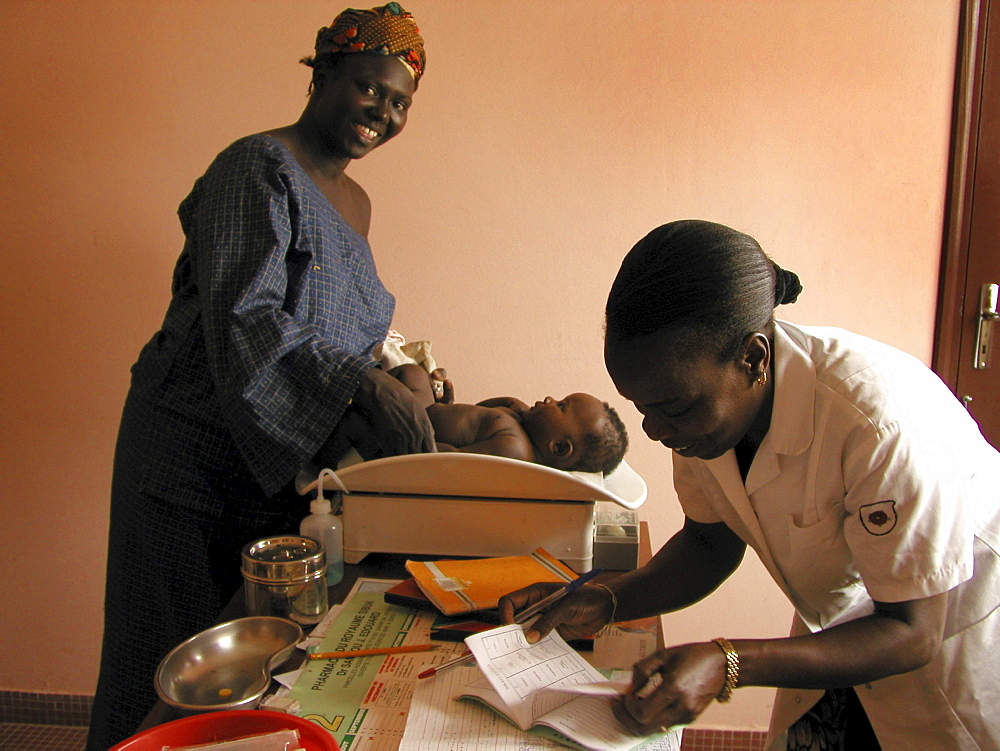 Senegal child being weighed service center, dakar