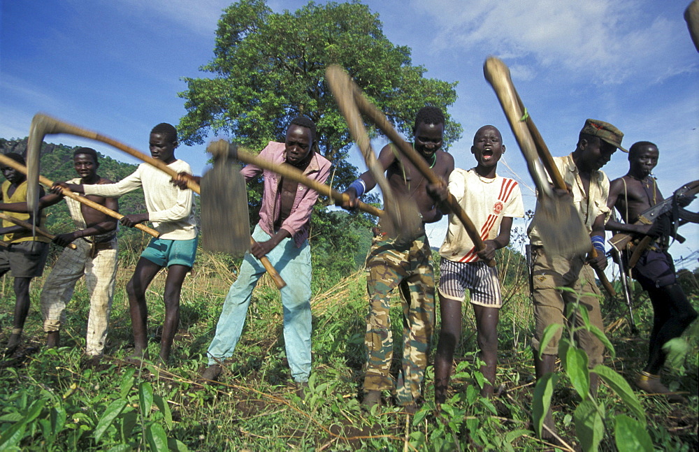 South sudan soldiers cultivating field chukudum