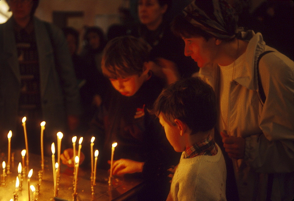 Russia lighting candles at sts. Cosmas and damien russian orthodox church, moscow