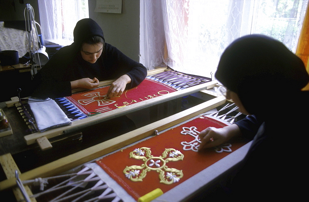 Labor embroidering church ornament, ternopil, ukraine