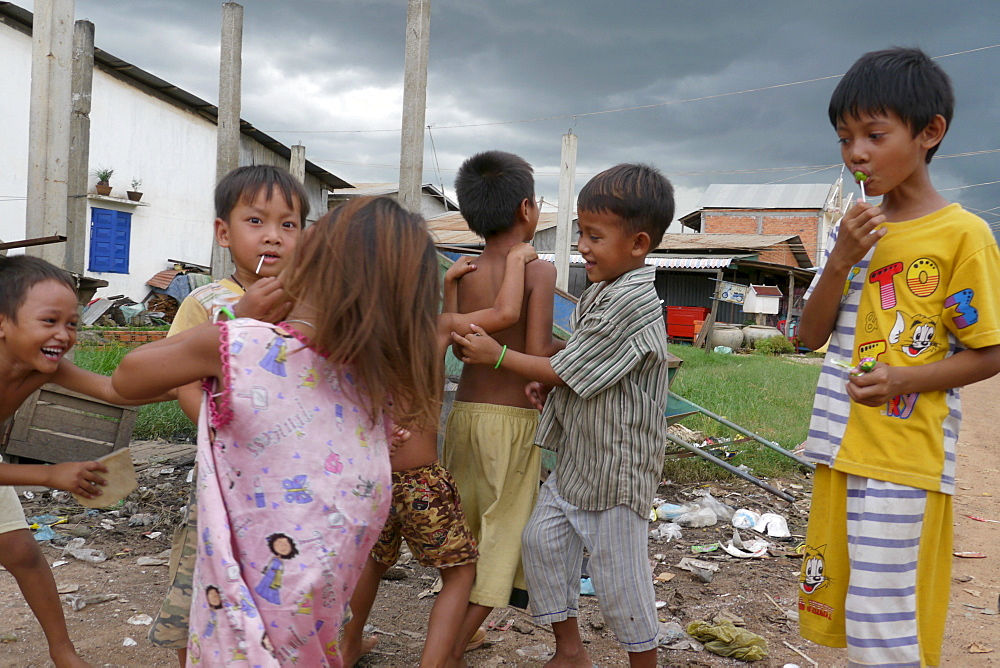 CAMBODIA Samaky, a resettlement area for former slum dwellers who were forcibly moved out of their former homes in central Phnom Penh. Children playing at market