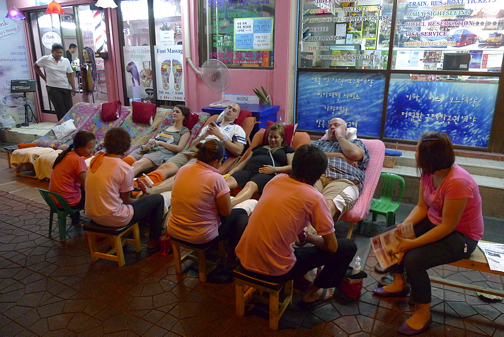 THAILAND Khao San Road, Bangkok. Budget tourism area. Massage on the street. Photo by Sean Sprague