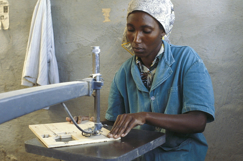 Kenya woman making jigsaw puzzle, nairobi