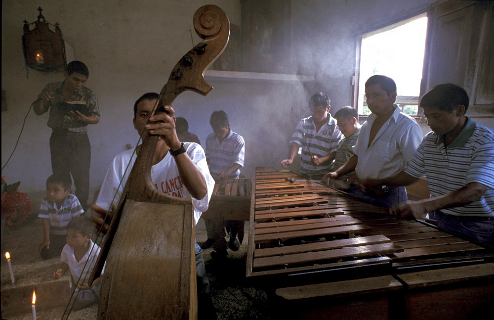 Guatemala marimba in a catholic church at cahaba, peten