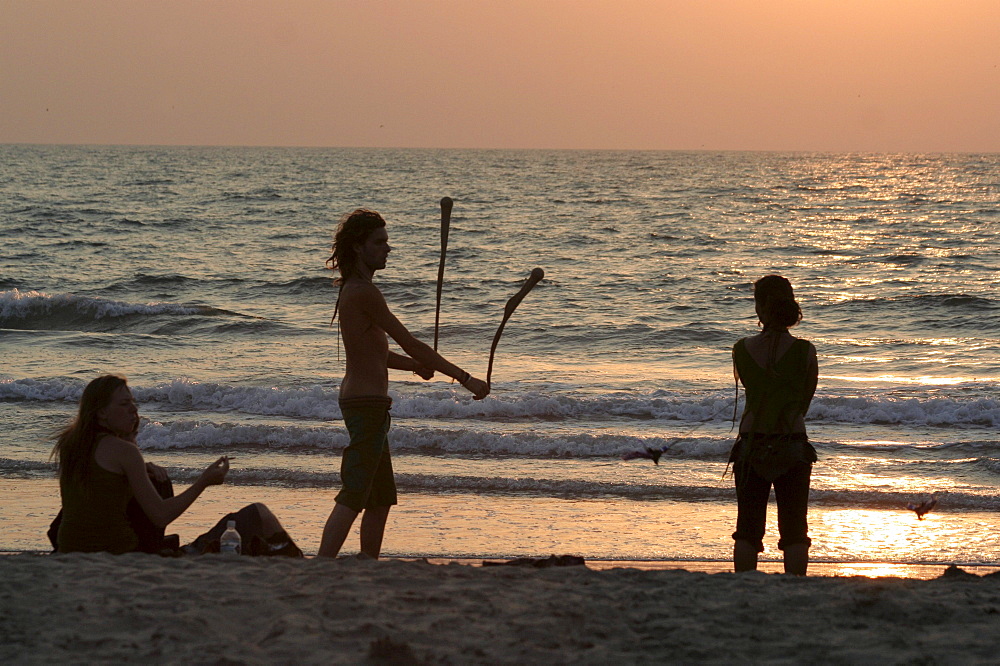 India israeli family on the beach at arambol, goa.