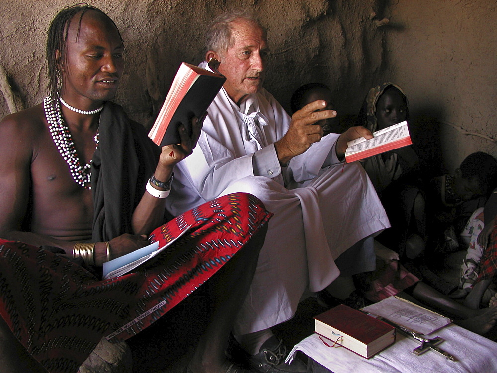 Watatulu tribals at catholic mass, tanzania. - with father dan ohman in a hut in mwankale