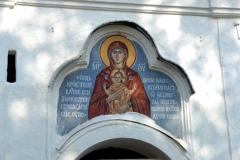 Russia detail of painting of mother of over doorway of an church in pskov