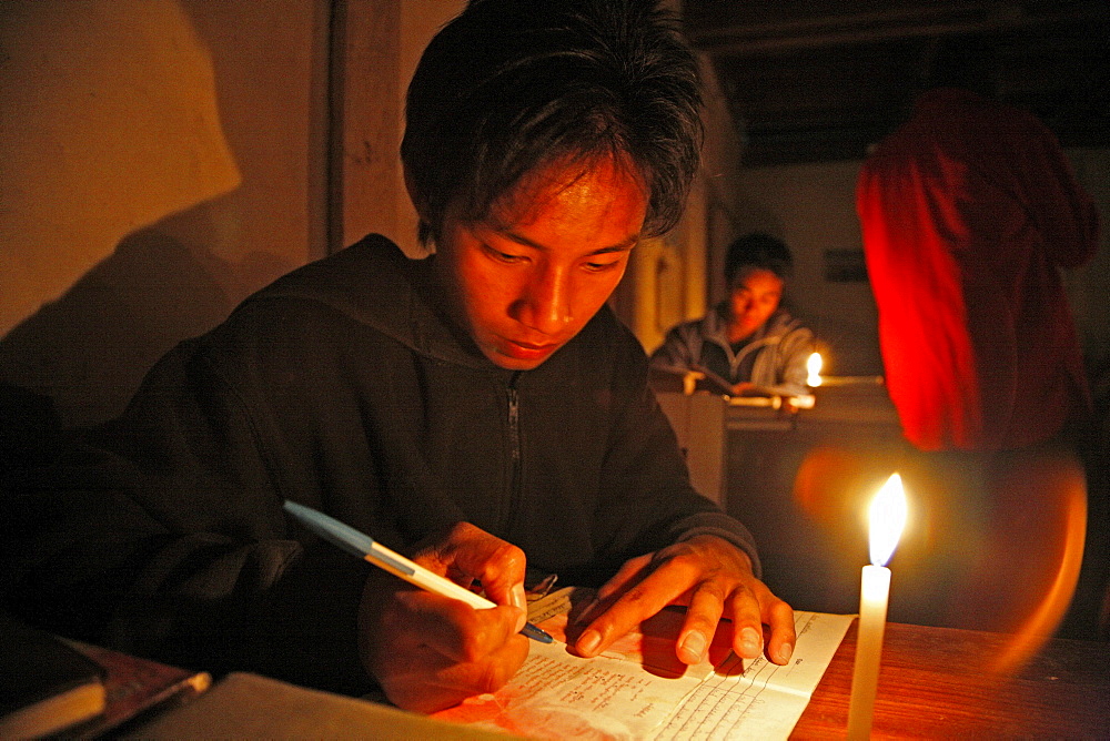 Myanmar catholic seminarians studying by candlelight (in a place with frequent power outs) myitkyina, a largely kachin community in north burma near chinese border 