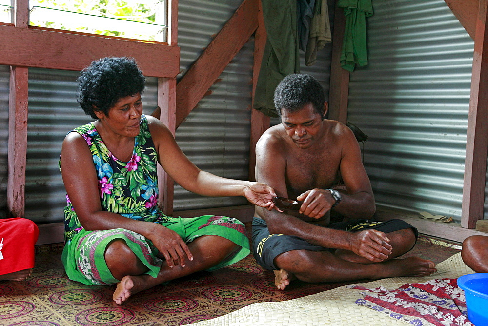 Fiji villagers enjoying a bowl of kava (grog), lavena village, taveuni photo by sean sprague