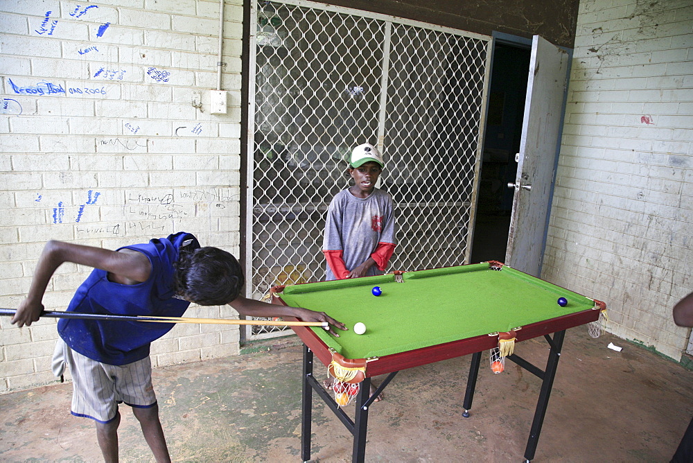 Australia aborigine community of , or beswick, arnemland, northern territory. Boys playing poo