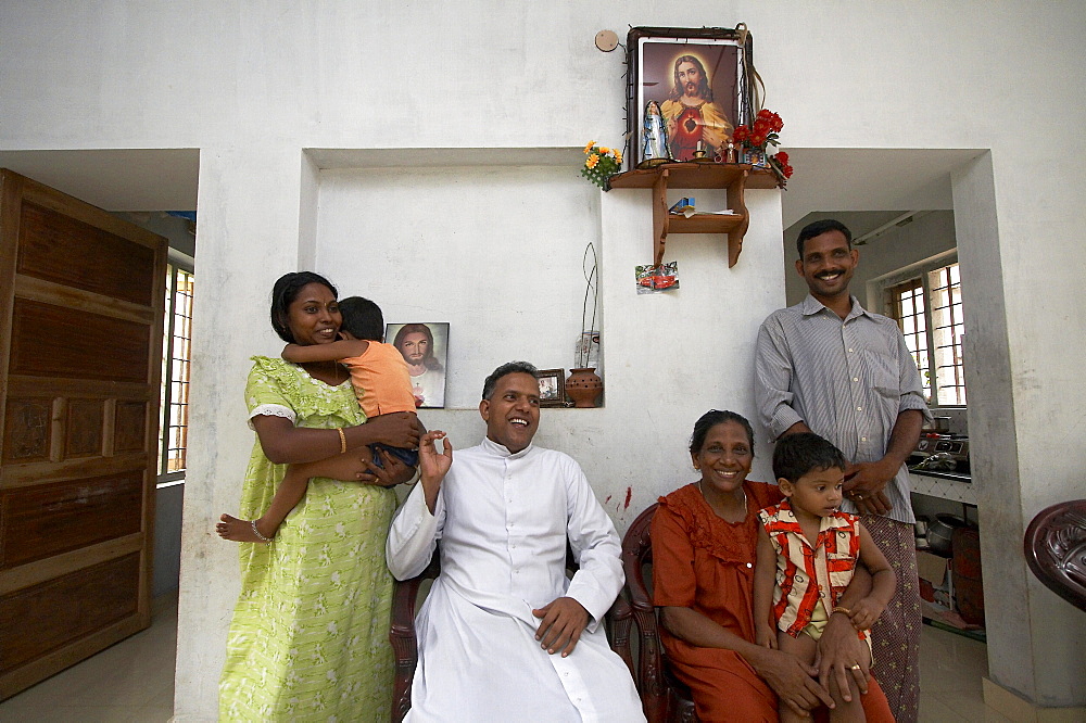 India. Father jose thottakara visiting small house of michael and jophy jaison. House building project funded by social services department of ernakulum diocese by father jose thottakara, kerala