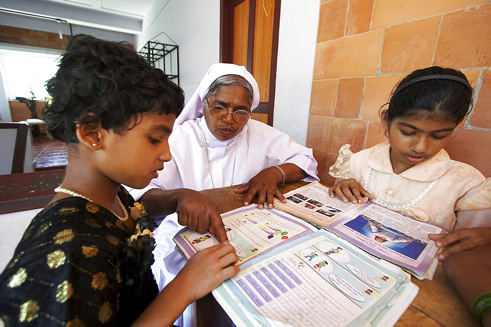 India. Study and reading time, helped by sister jane thennattil (director).Mary Matha bala bhavan, a girls orphanage run by syro-malabar catholic missionary sisters of mary immaculate (msmi), chamal village, thamarassery diocese, khozikode, kerala. 2007   