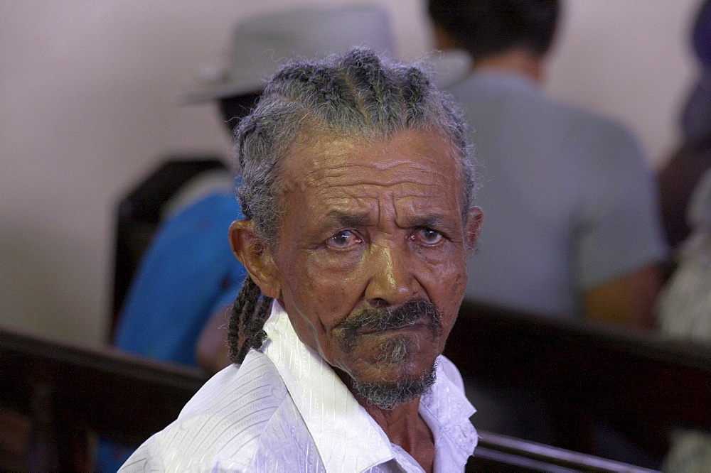 Jamaica. Man at sunday mass in the catholic church at seaford town