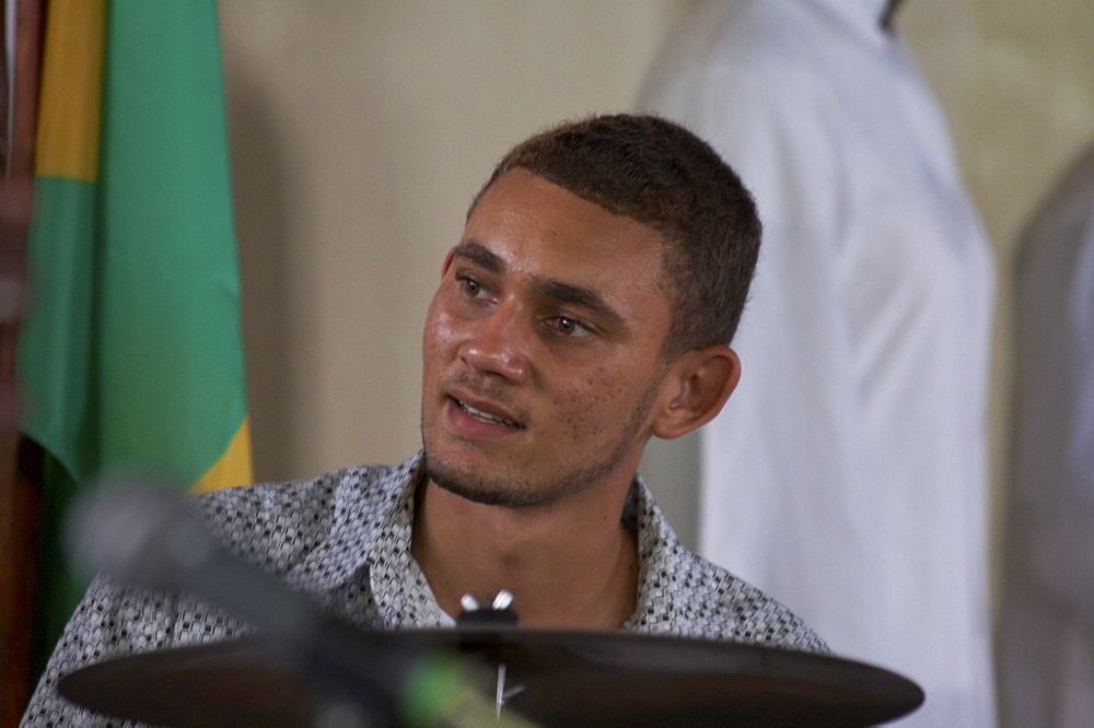 Jamaica. Drummer at sunday mass in the catholic church at seaford town